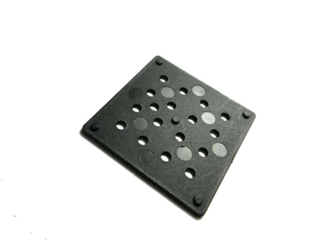 Black perforated square metal plate on white background.