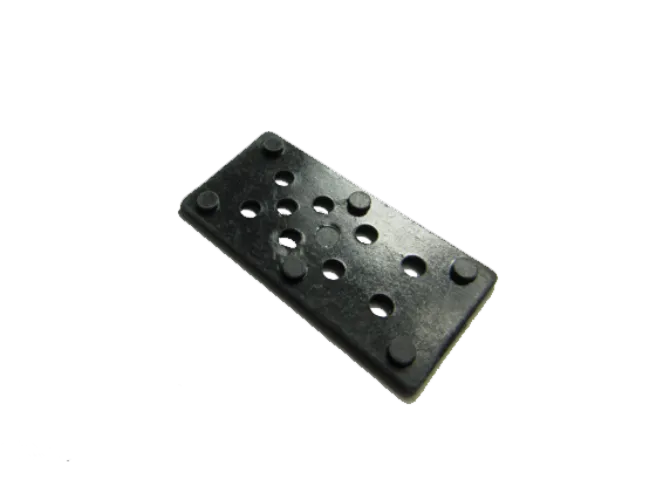 Black domino piece with dowels and holes.