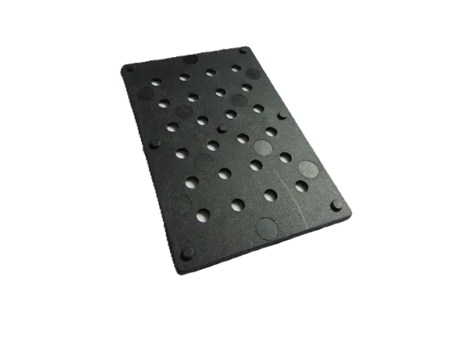 Rectangular perforated black plate with circular holes.